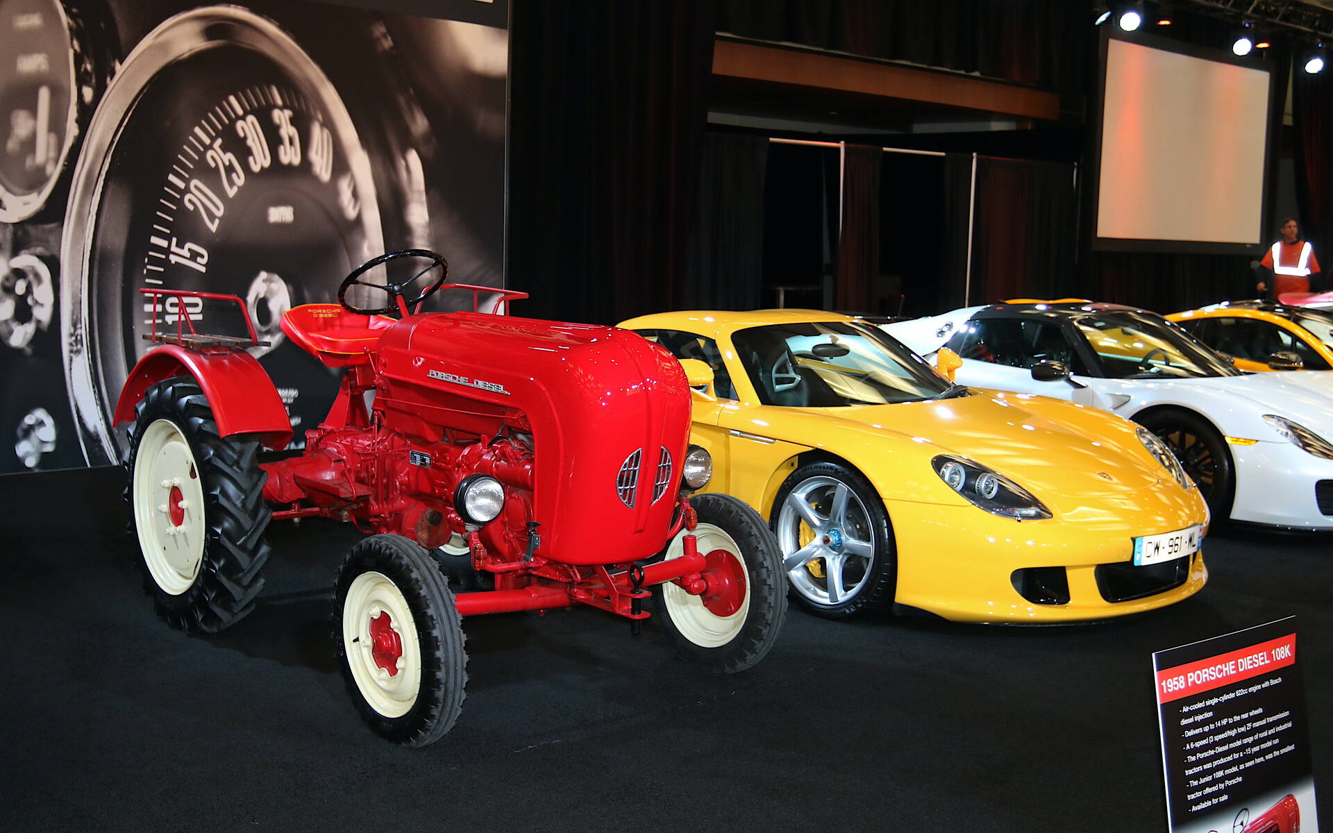 <p>1958 Porsche tractor and 2005 Porsche Carrera GT</p>